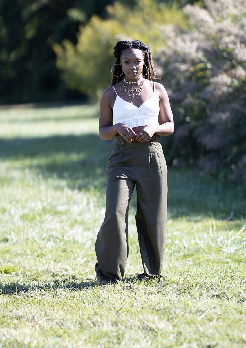 Woman standing in nature. Calm and confident