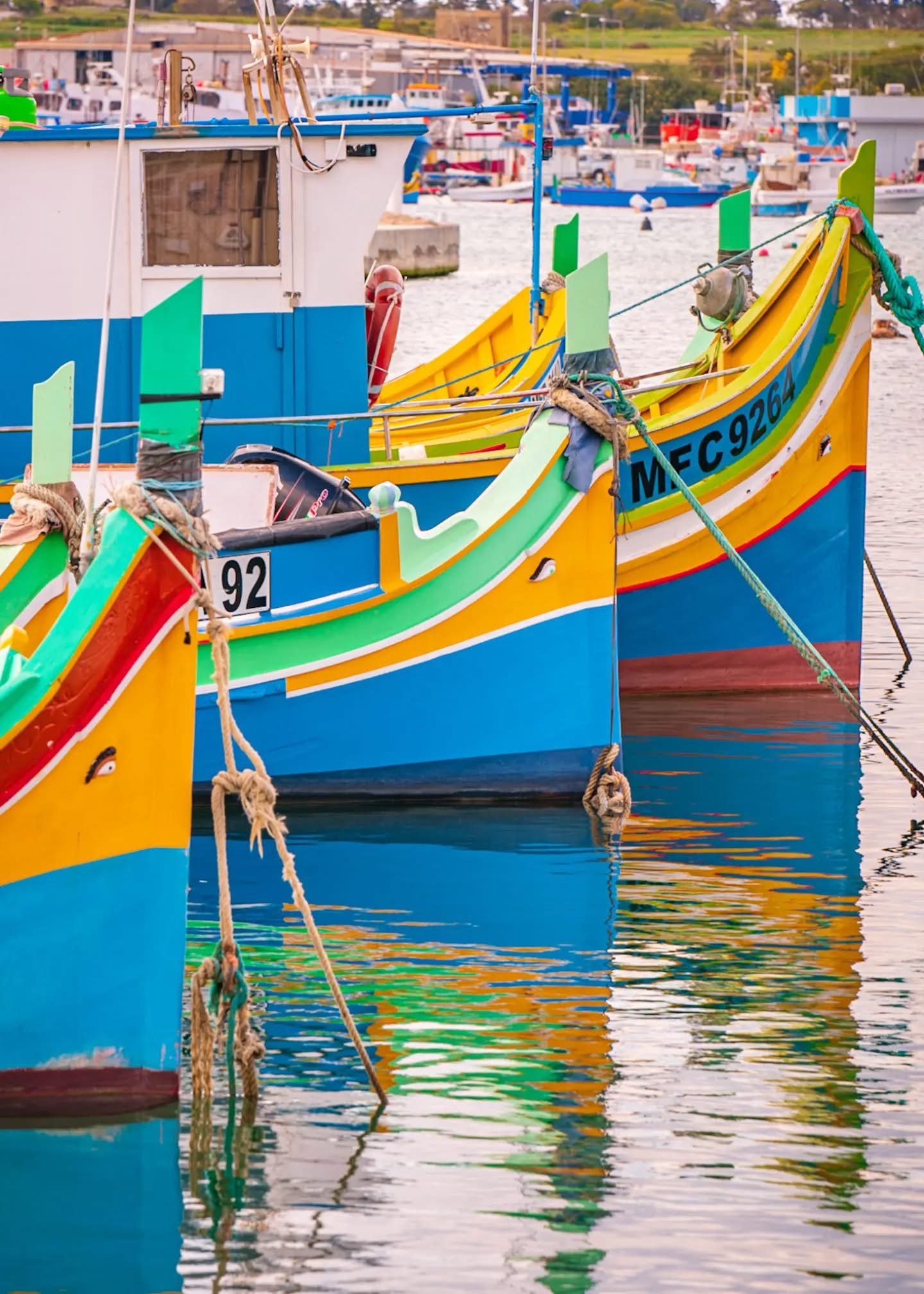 A luzzu is a traditional Maltese fishing boat, easily recognizable by its bright, colorful paint and the pair of eyes painted on the bow. These eyes, called the