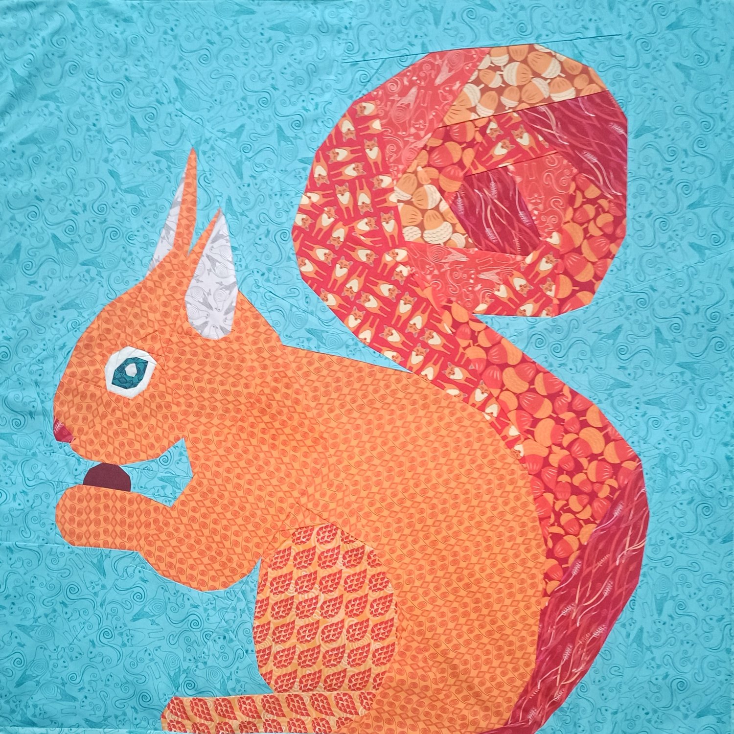 red squirrel eating a nut quilt block