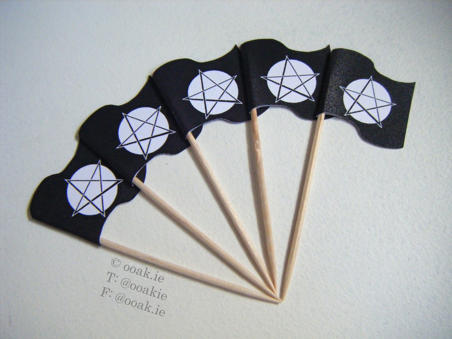 Printable sheet of mini Pentacle flags with a full moon background, shown as DIY gothic cupcake toppers.