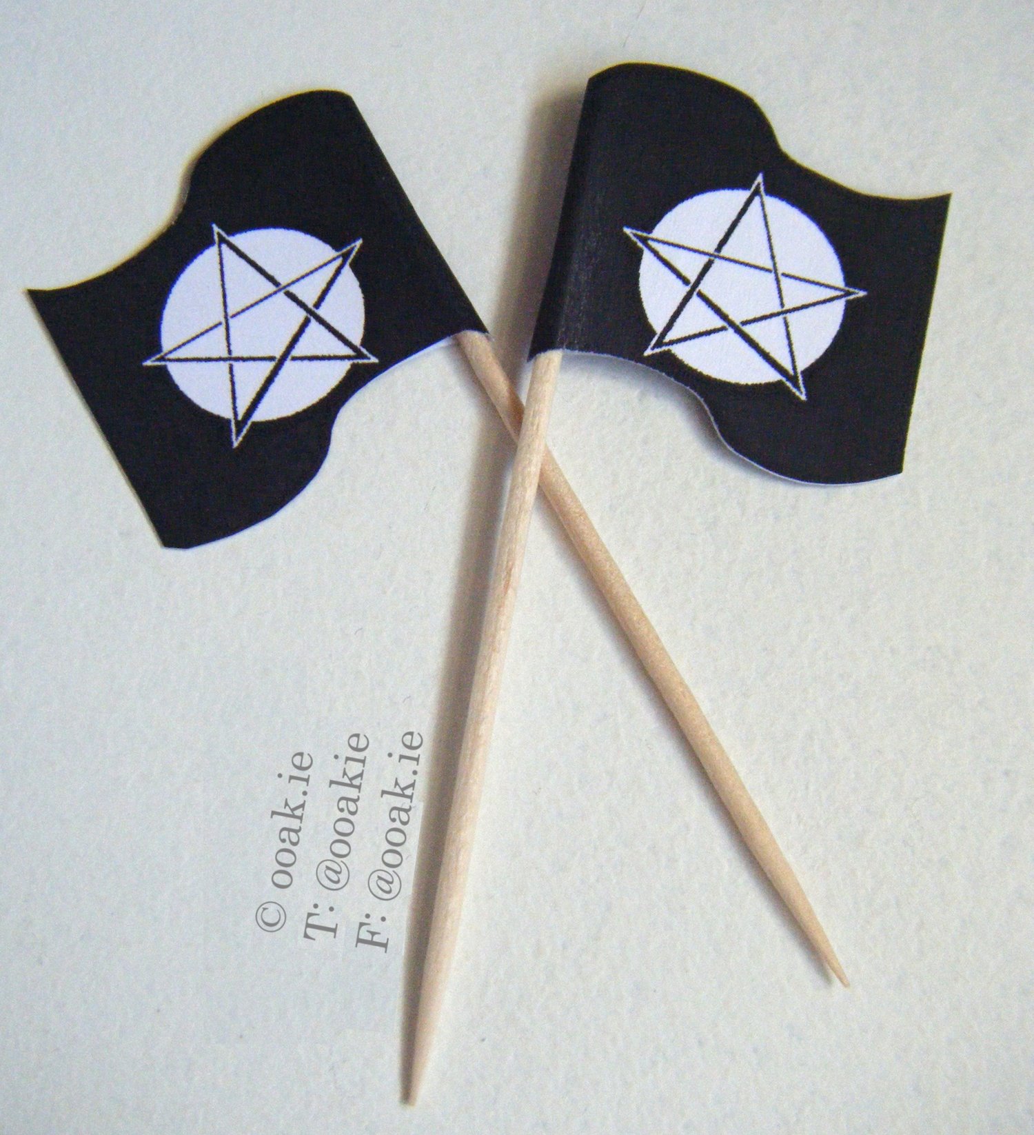Printable sheet of 25 black and white Pentacle flags with a full moon background, shown as DIY gothic snack picks..