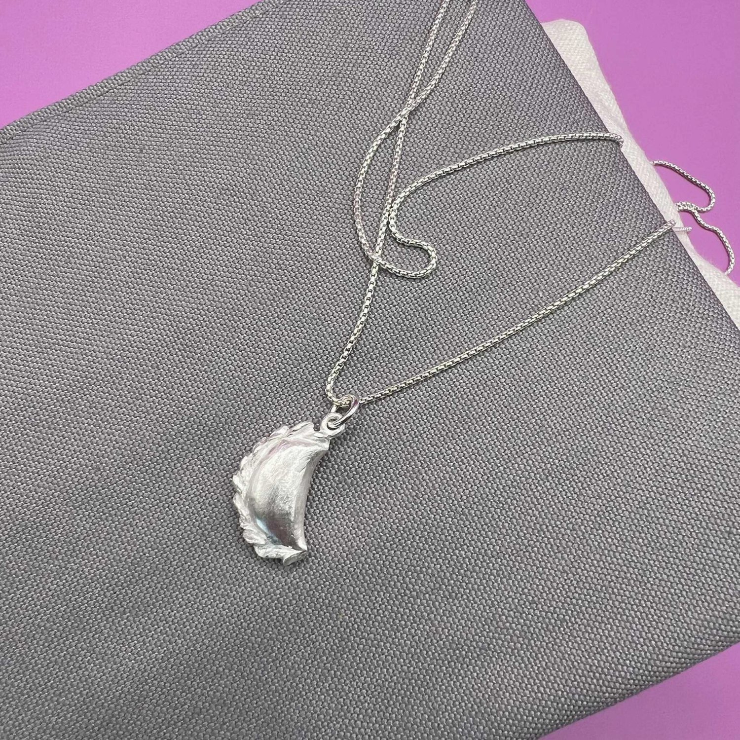 Silver curry puff pendant with chain