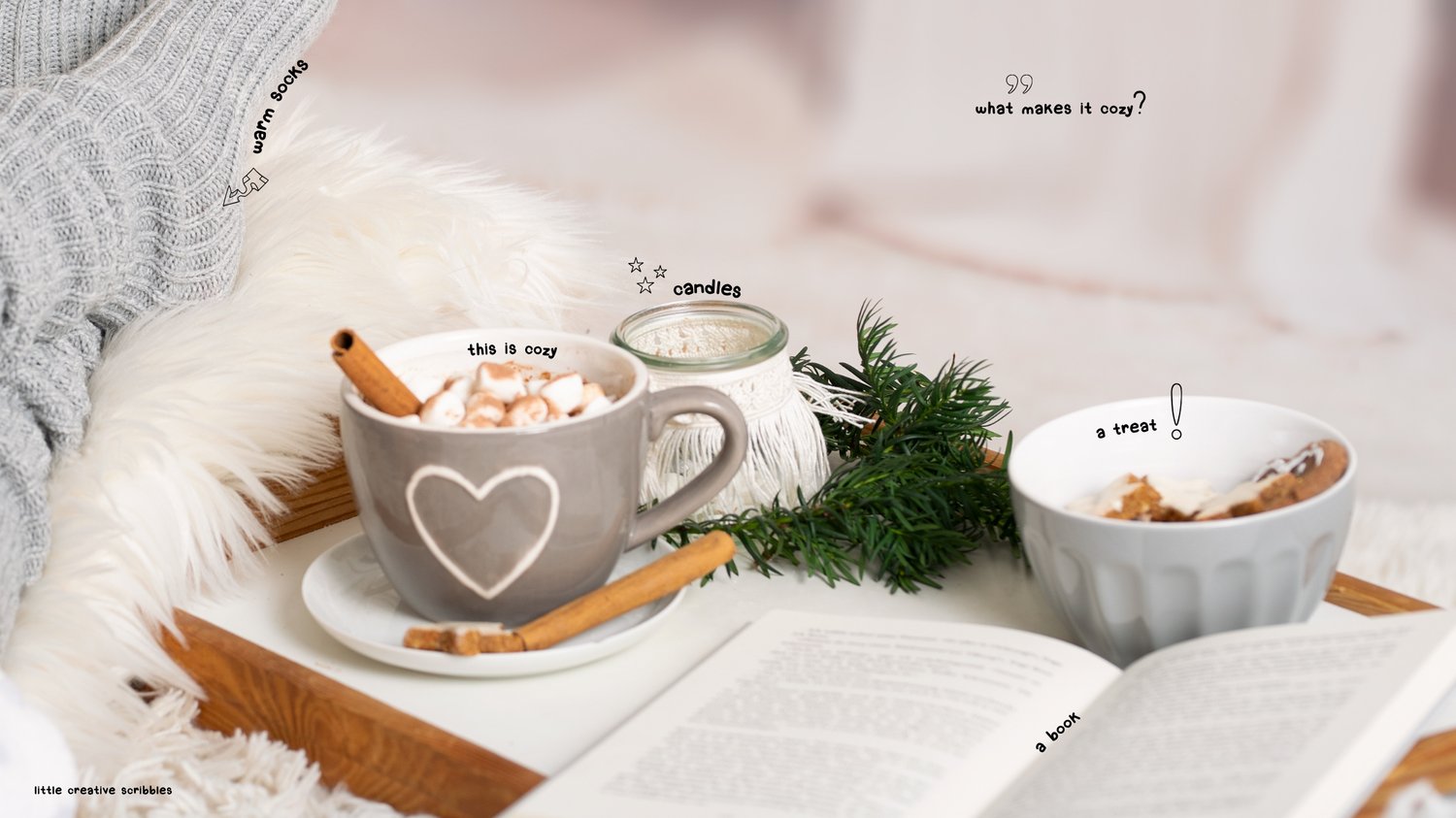 hot chocolate and a book next to a person wearing cozy socks