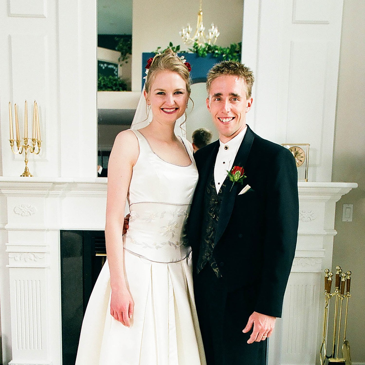 Talena and her husband in their wedding clothes.