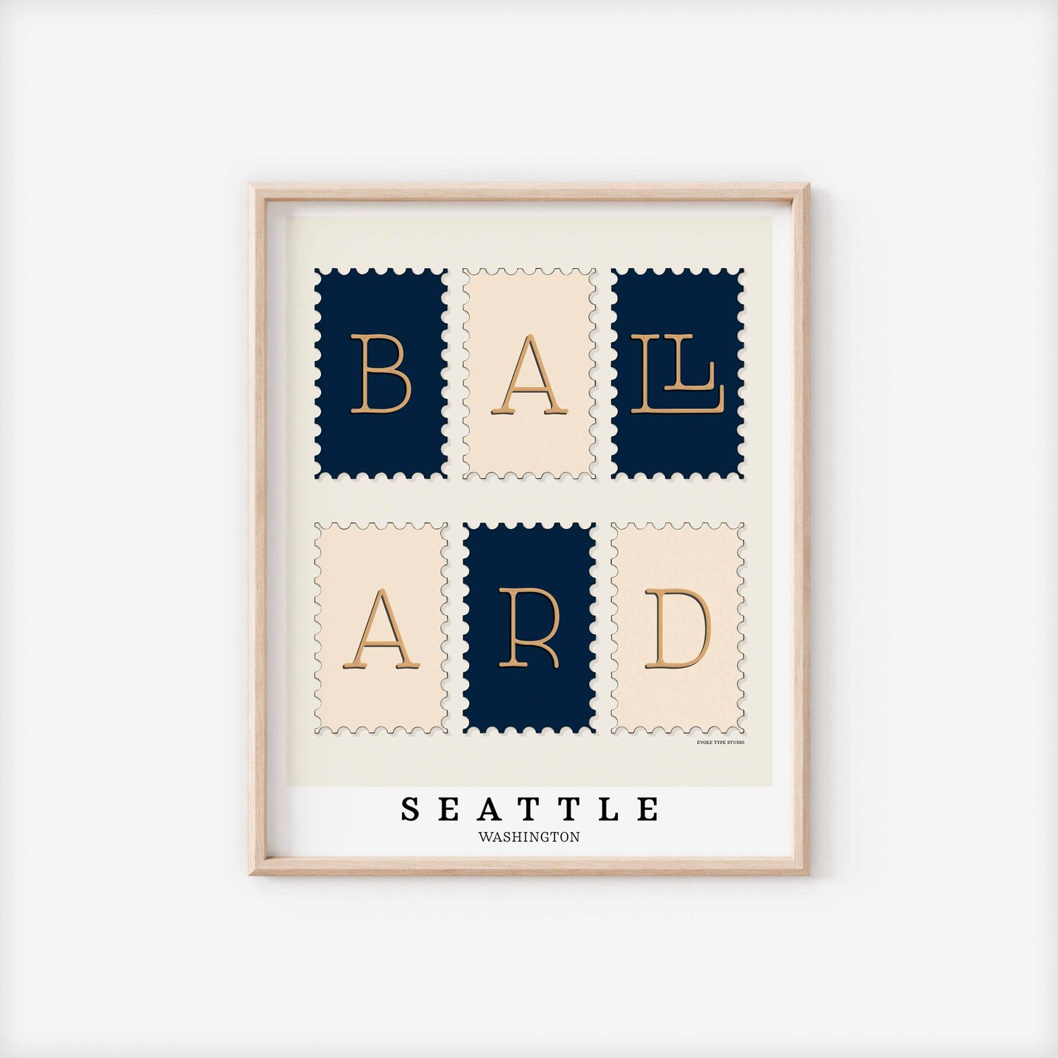 A framed picture of postage stamps featuring the Ballard neighborhood in Seattle, Washington drawn in a unique lettering style. Artwork has a navy blue, beige and tan color scheme