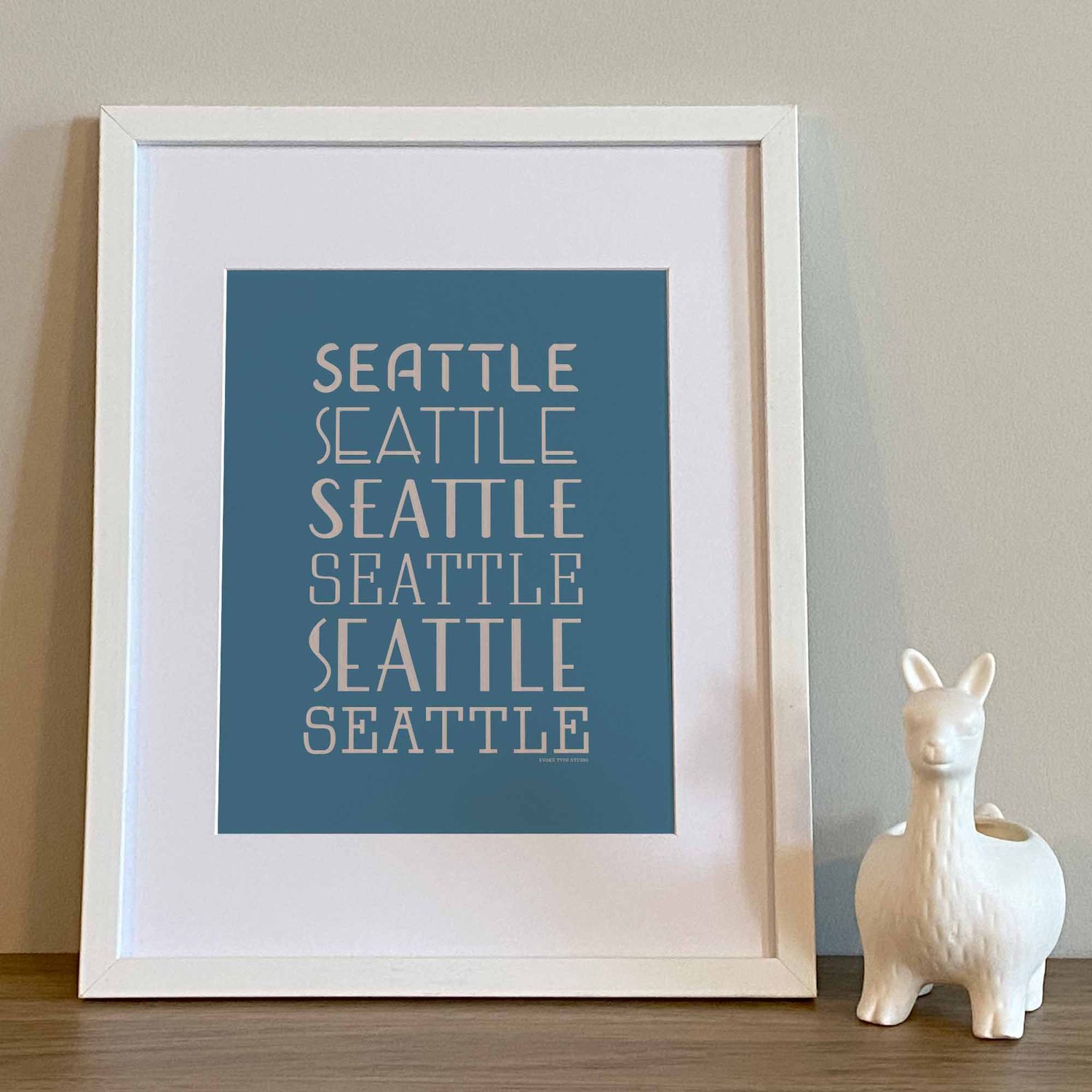 Type stack style Seattle art print with six expressive hand-lettered typography designs in blue and beige