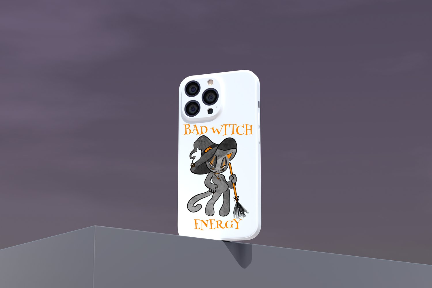 A white phone case stands on a grey background. On it, there is an illustration of a black and orange cat in a witch hat holding an orange broom. Orange text reads "Bad Witch Energy."