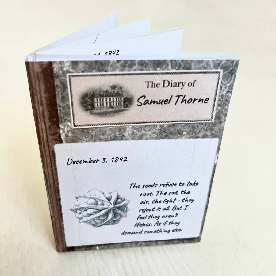 A close-up of the assembled 'Diary of Samuel Thorne' puzzle prop for the printable escape room 'The Secret of Langton Manor: Episode 4'. The booklet is open to an entry dated December 3, 1842, discussing mysterious seeds that refuse to grow.