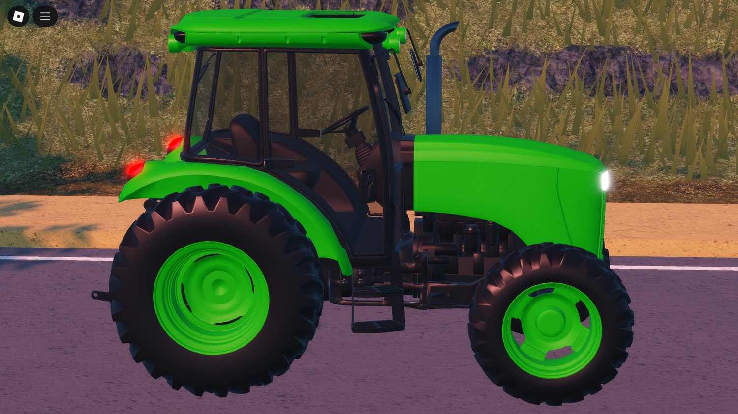 Decorative tractor model next to barn