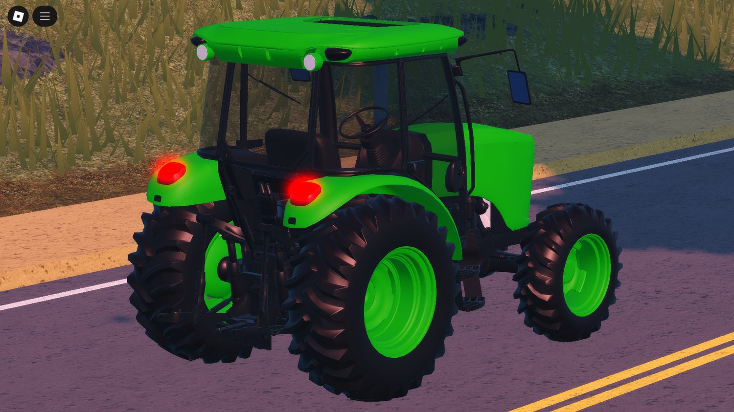 Green John Dear style tractor in crop field
