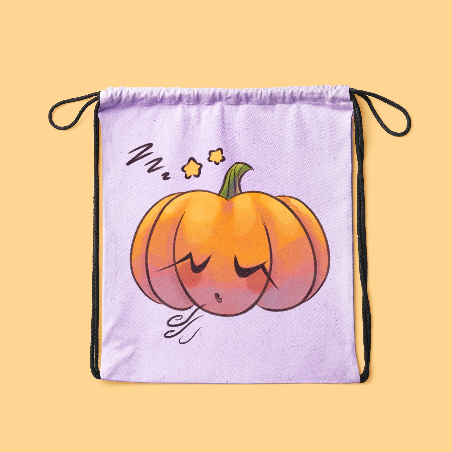 A lavender drawstring bag against an orange background. There’s a cartoony, watercolour illustration of a jack-o-lantern sleeping on it, with three Z’s and stars above it.