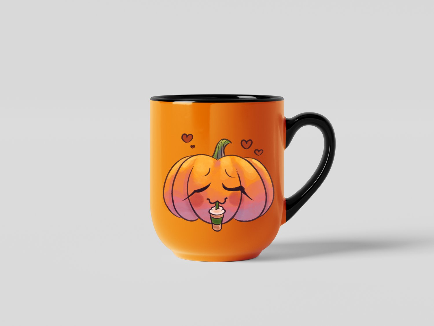 An orange mug with a black handle and inside on a grey background. There is a cartoony, watercolour illustration of a jack-o-lantern drinking a pumpkin spice frappe on the mug. Hearts are floating above the pumpkin.