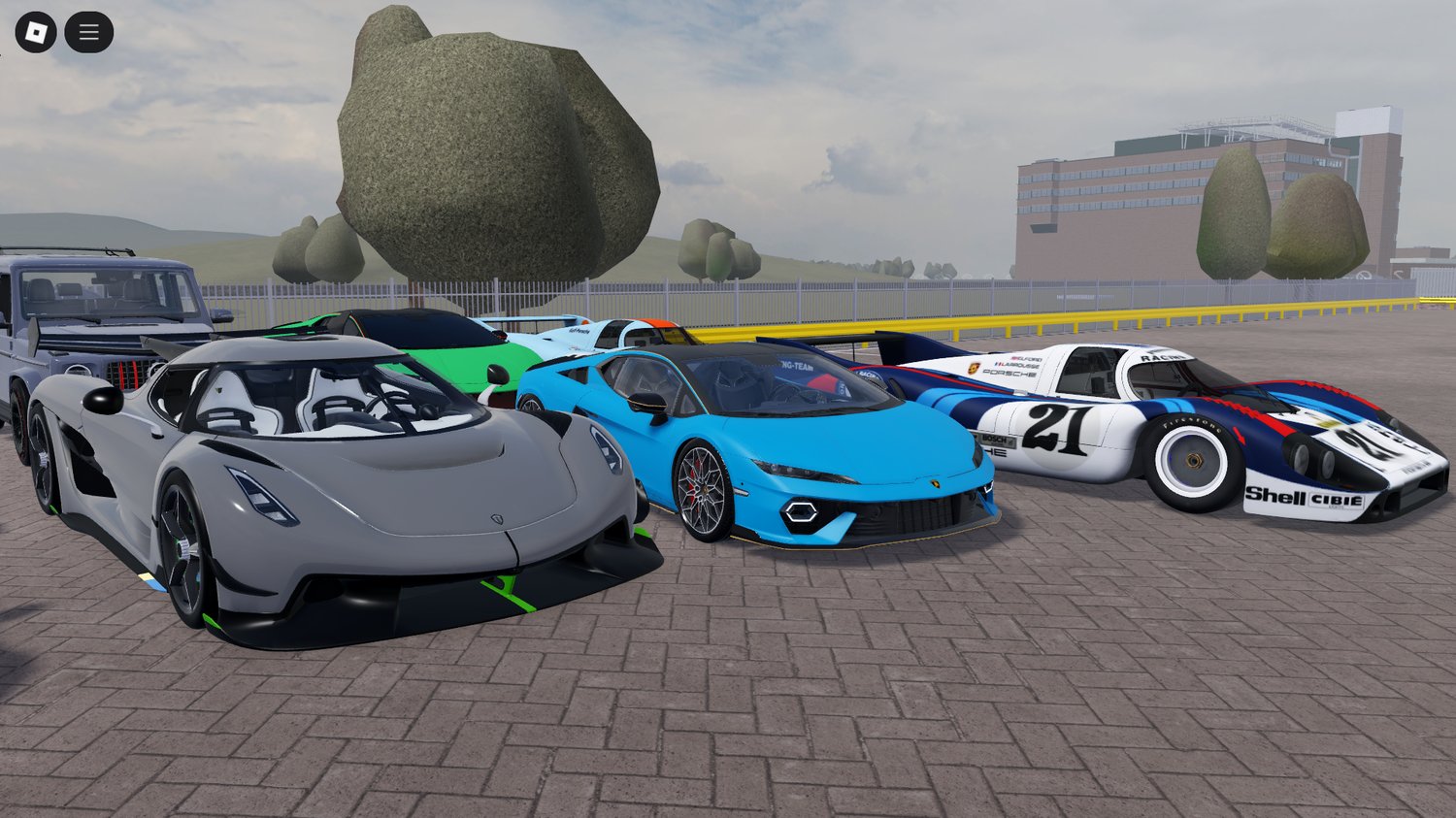 Sports cars parked in front of skyscrapers in Roblox