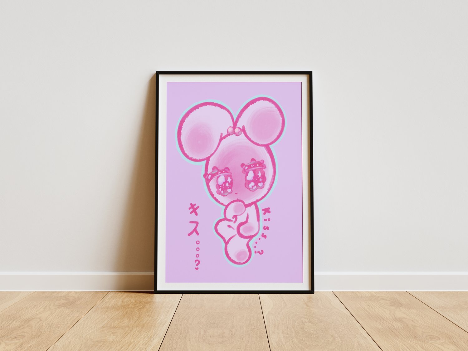 An illustration of a kawaii, white rabbit blushing with big anime eyes. Decorative, pink text in both English and Japanese reads “Kiss…?” The illustration is in a picture frame with a thin black border. It rests against a white wall, standing on a light-b