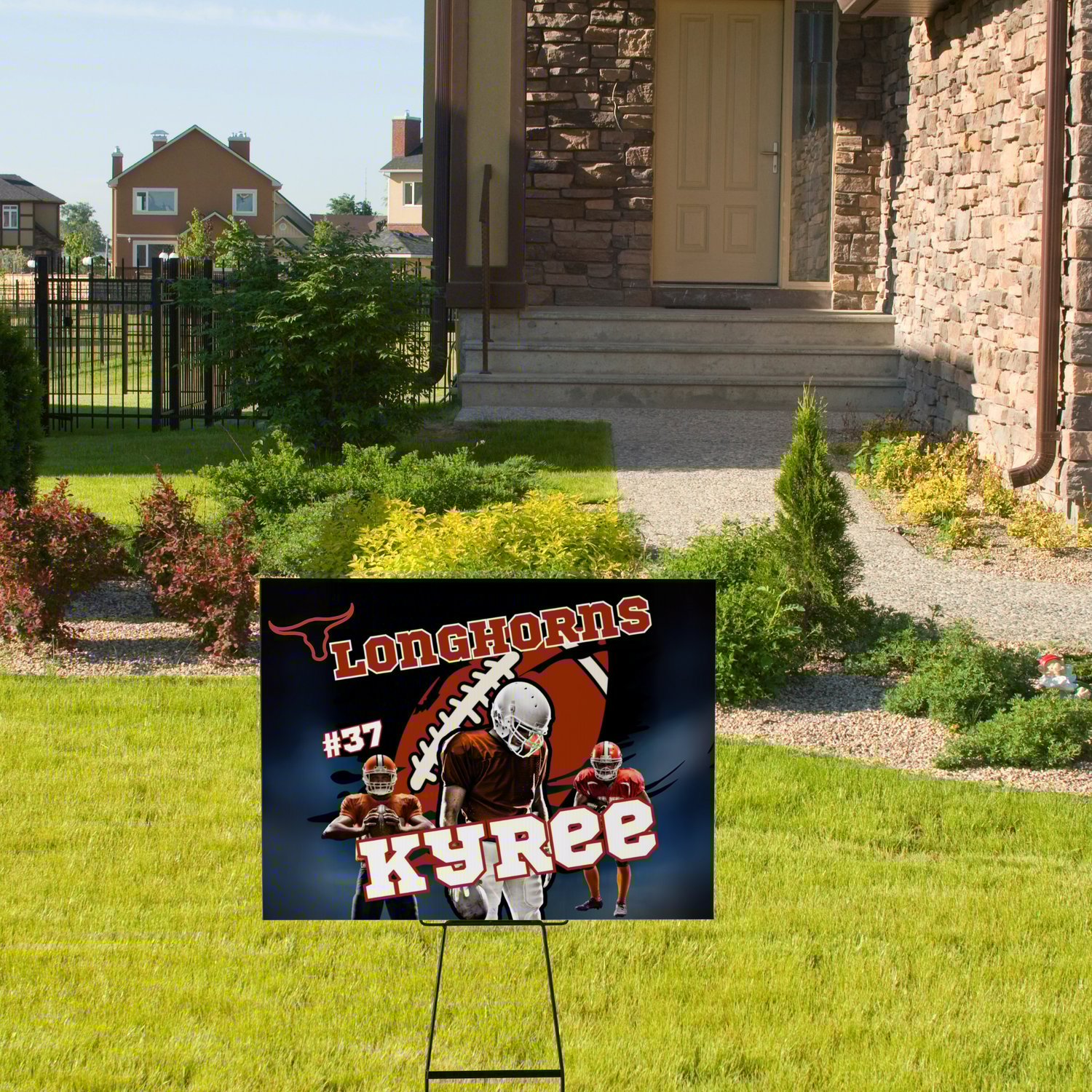 Image of football player with football and a sign in front of a house