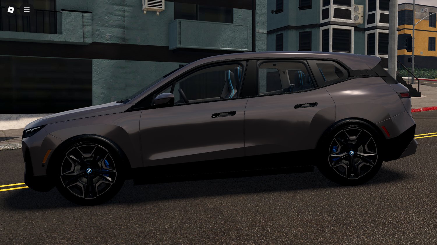 Player driving BMW iX xDrive50 in Roblox city map