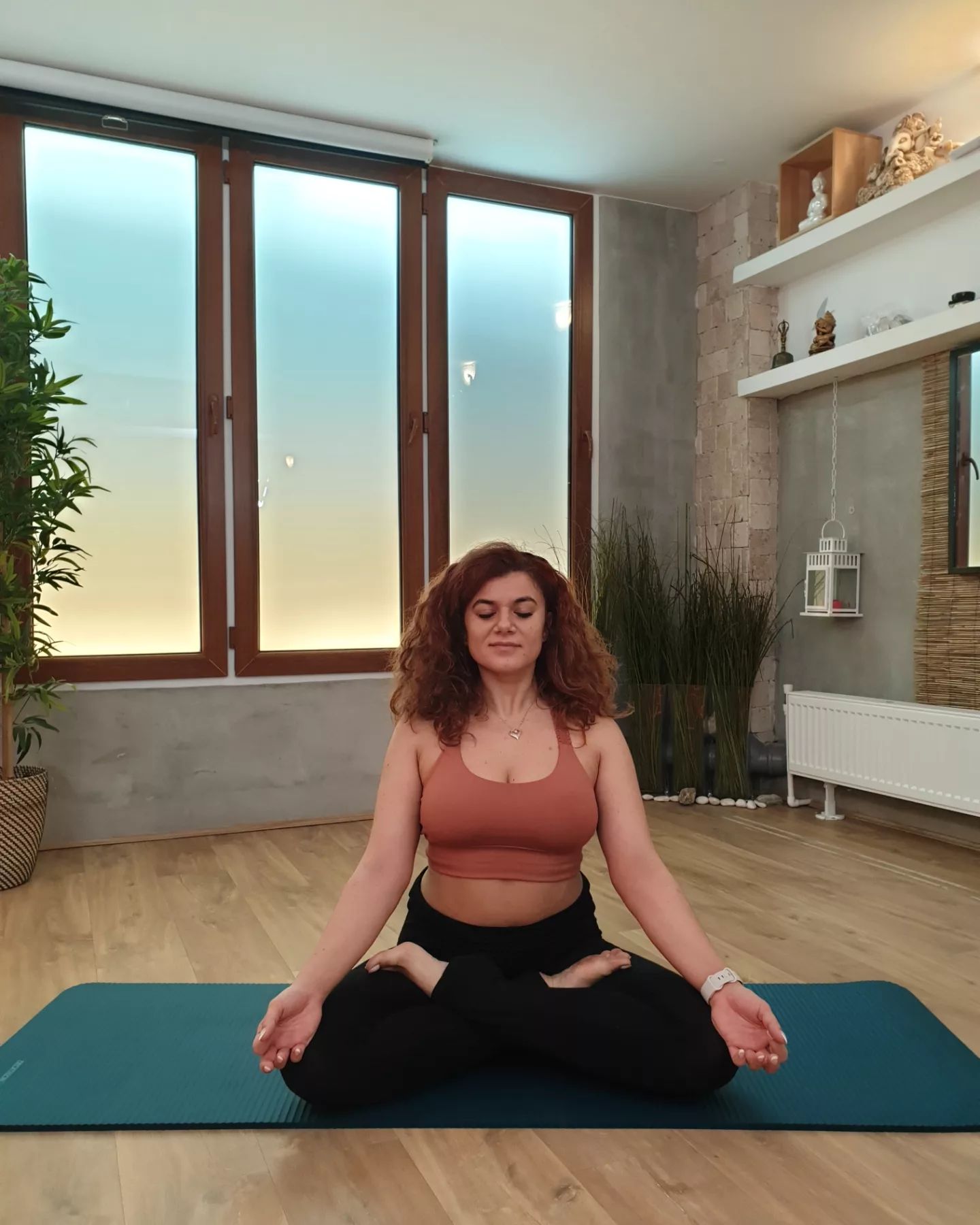 woman practicing meditation seated in lotus pose on yoga mat – Elementar by Maya