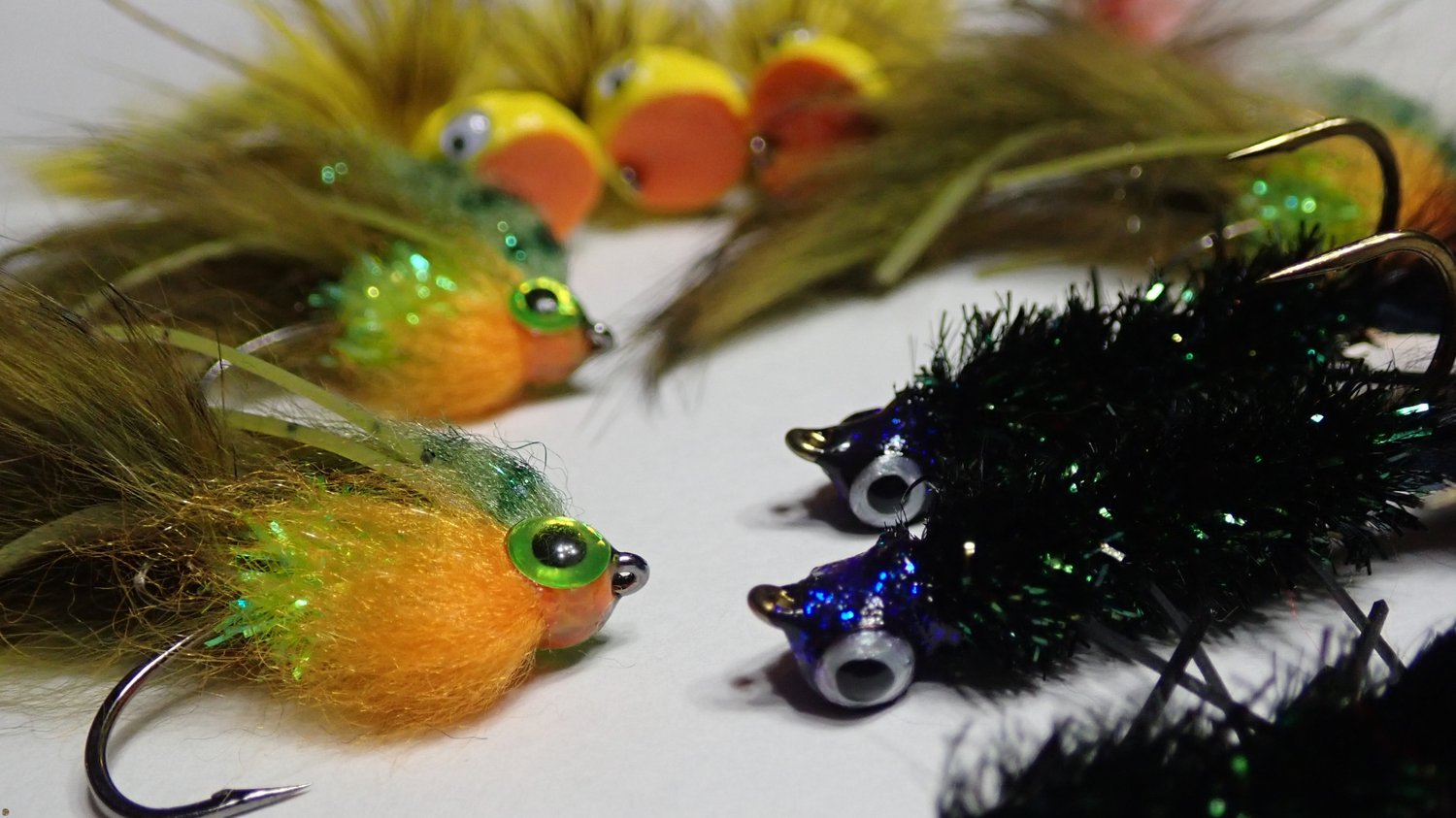 Bass fly group, streamers, jig flies, and poppers, hand-tied by Matt Campbell, The Fly Guy.