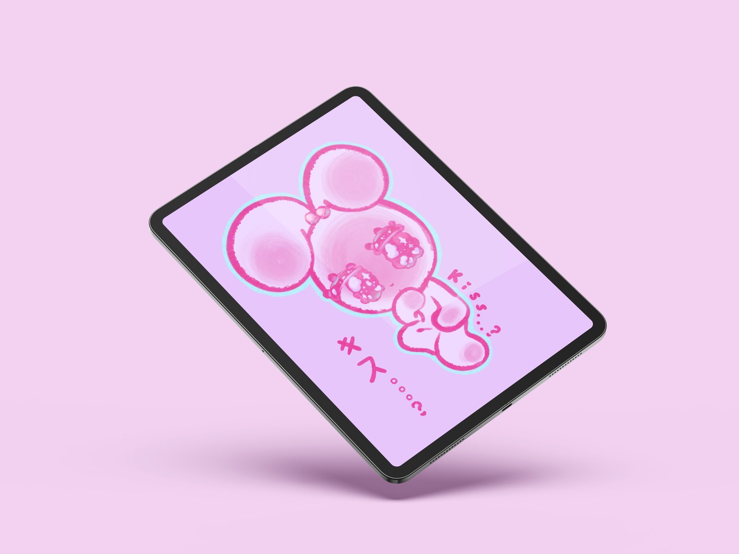 A tablet floats, tilted toward the viewer. It has a wallpaper of a cute pastel pink rabbit with a purple background, with both Japanese and English text that reads “Kiss…?”