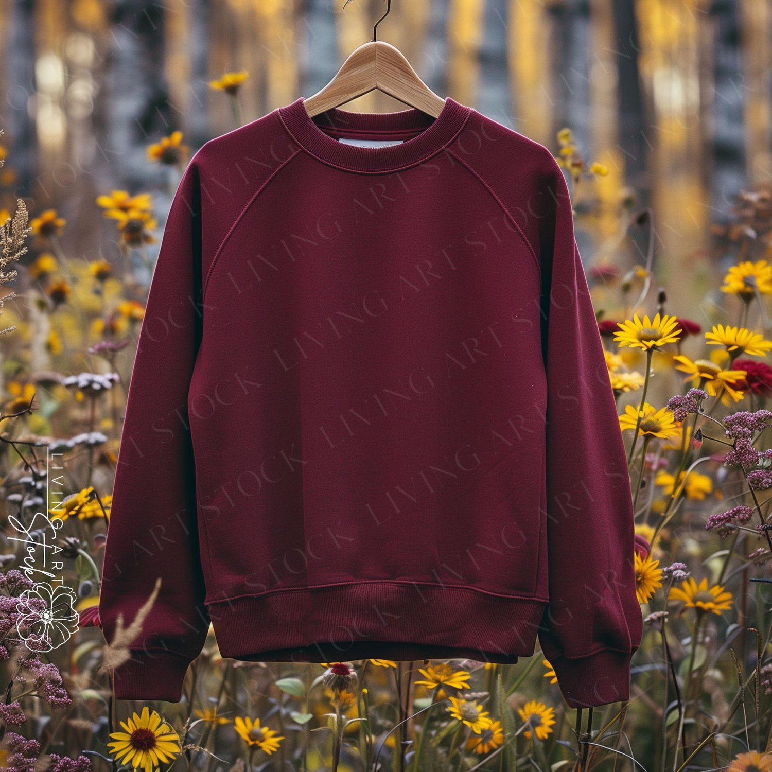 Maroon Blank Sweatshirt Hanging from Wooden Hanger with Yellow Daisy Garden in the Background, Sweatshirt Mockups