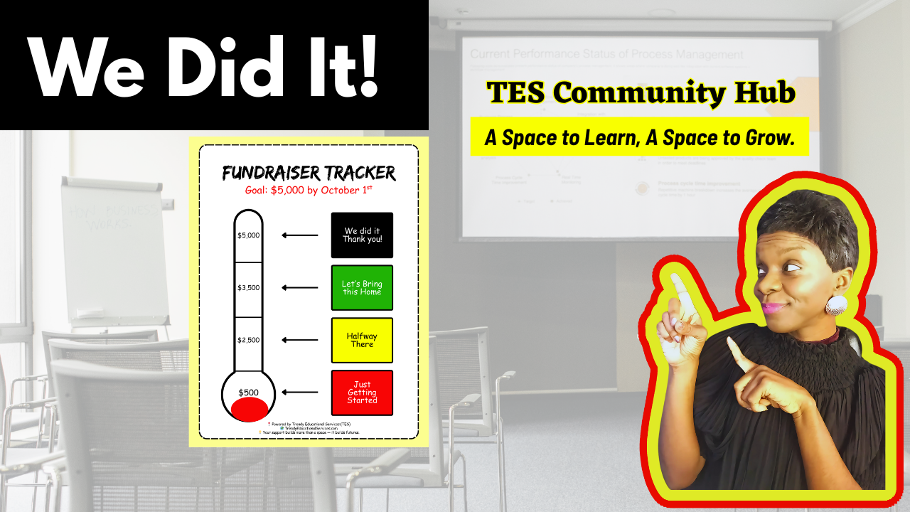 TES founder, Joy Voltaire pointing to TES  Community Hub Fundraiser Thermometer
