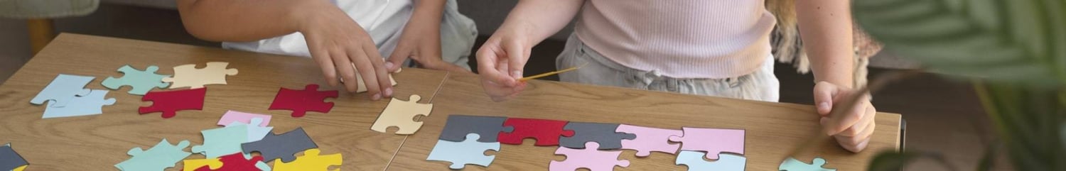 Children putting coloured puzzle pieces together