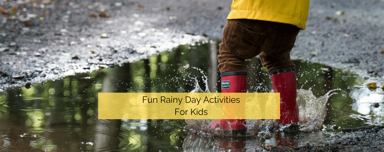 Fun rainy day activities for kids - two children jumping in puddles