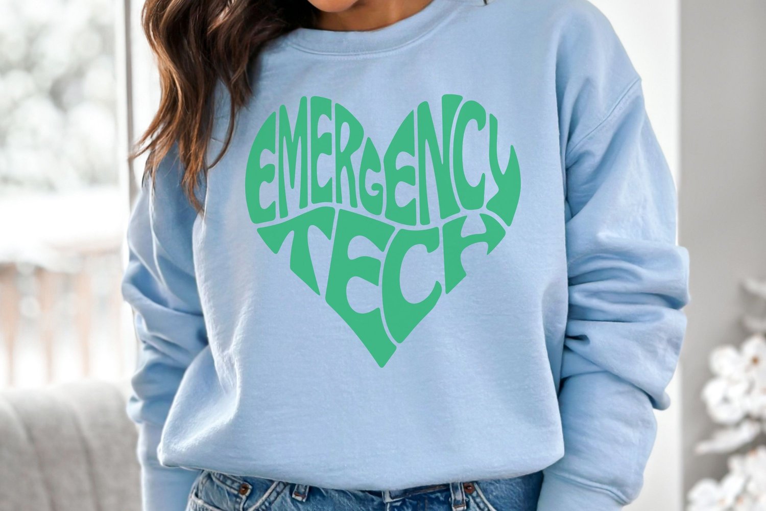 This design features the words Emergency Tech, creatively made into the shape of a heart.
