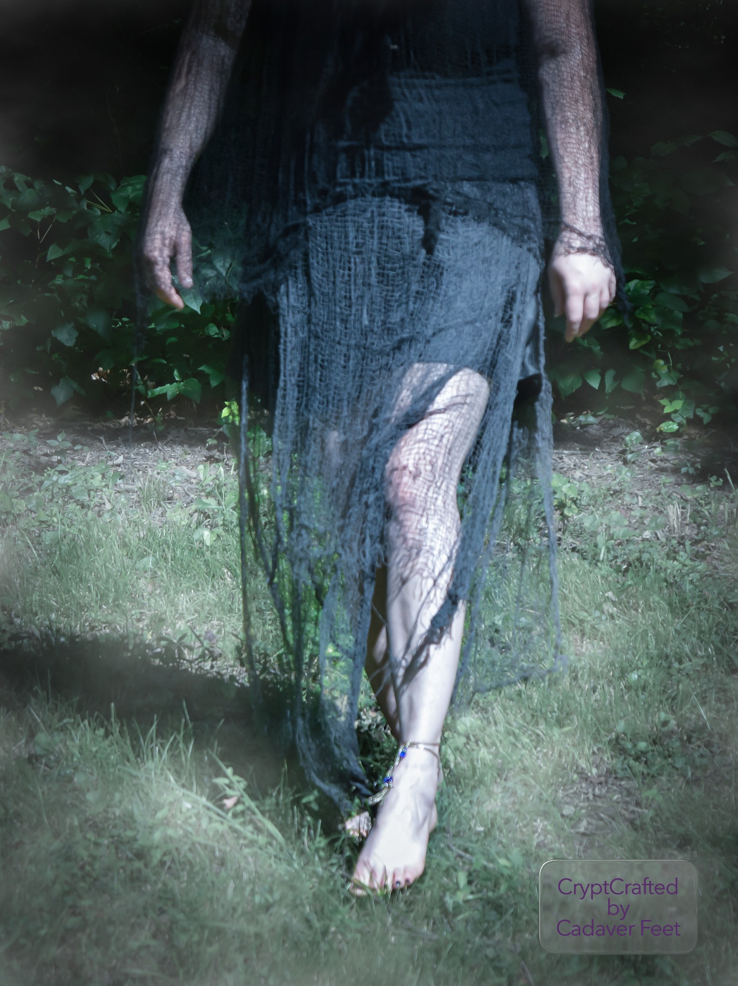 a person in black netting walking in a field
