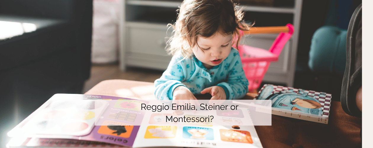 Child looking at a book - Reggio Emilia, Steiner or Montessori approach