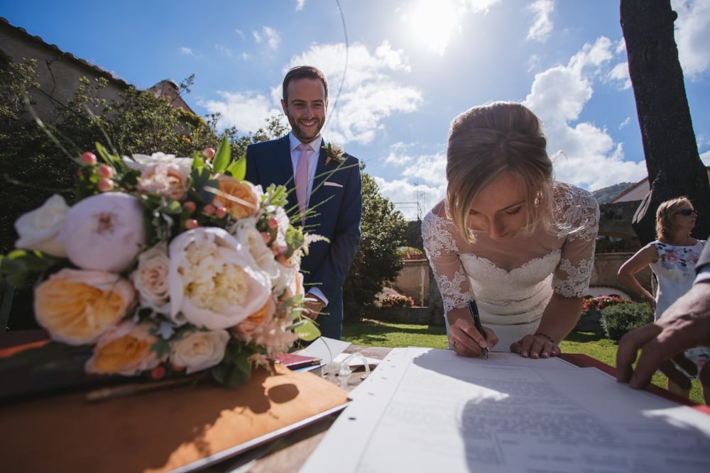 Bride signing register in Ravello. Image by The Bros Photography