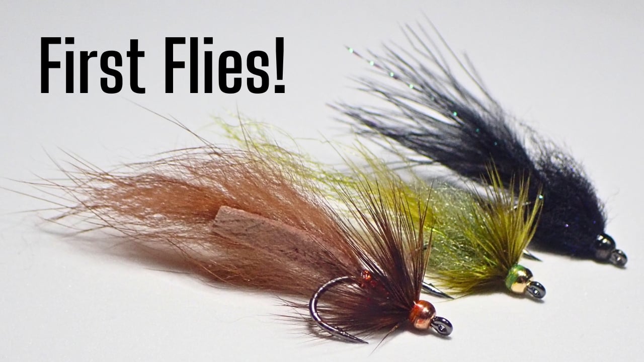 Close-up of three beadhead mini leech trout streamers in brown, olive, and black with text “First Flies!”