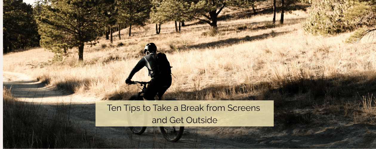 man riding his bike in nature - 10 tips to take a break from screens and get outside