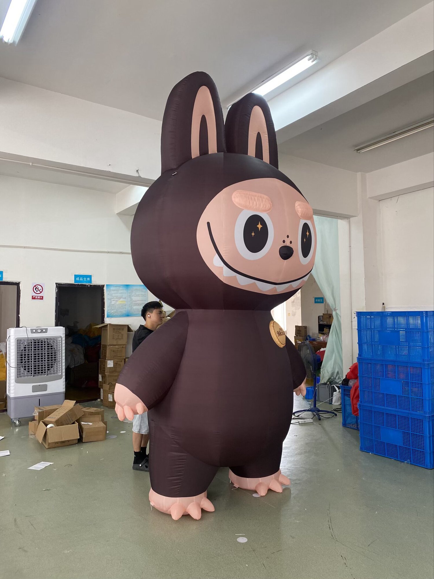 How big is the Labubu inflatable? Shown next to a person for scale