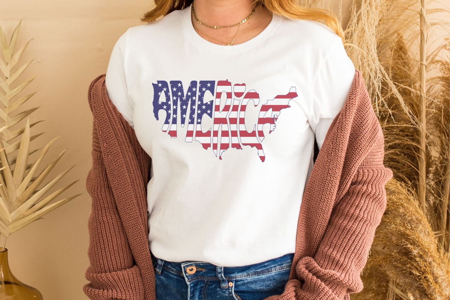 This patriotic design features the word America creatively arranged within the silhouette of the United States.