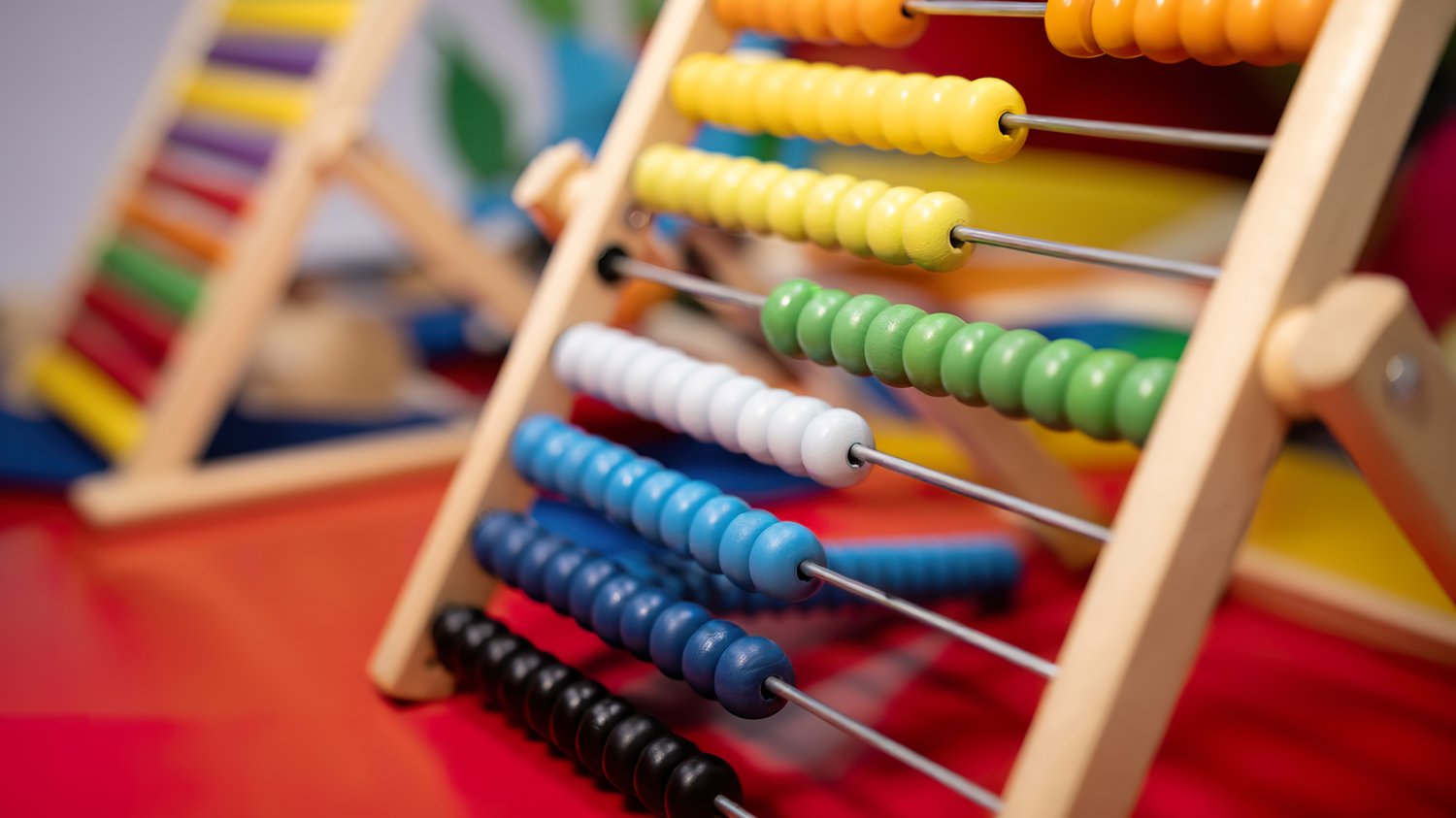 Early years classroom showing children engaged in learning foundational knowledge, supporting secure curriculum foundations for Ofsted expectations
