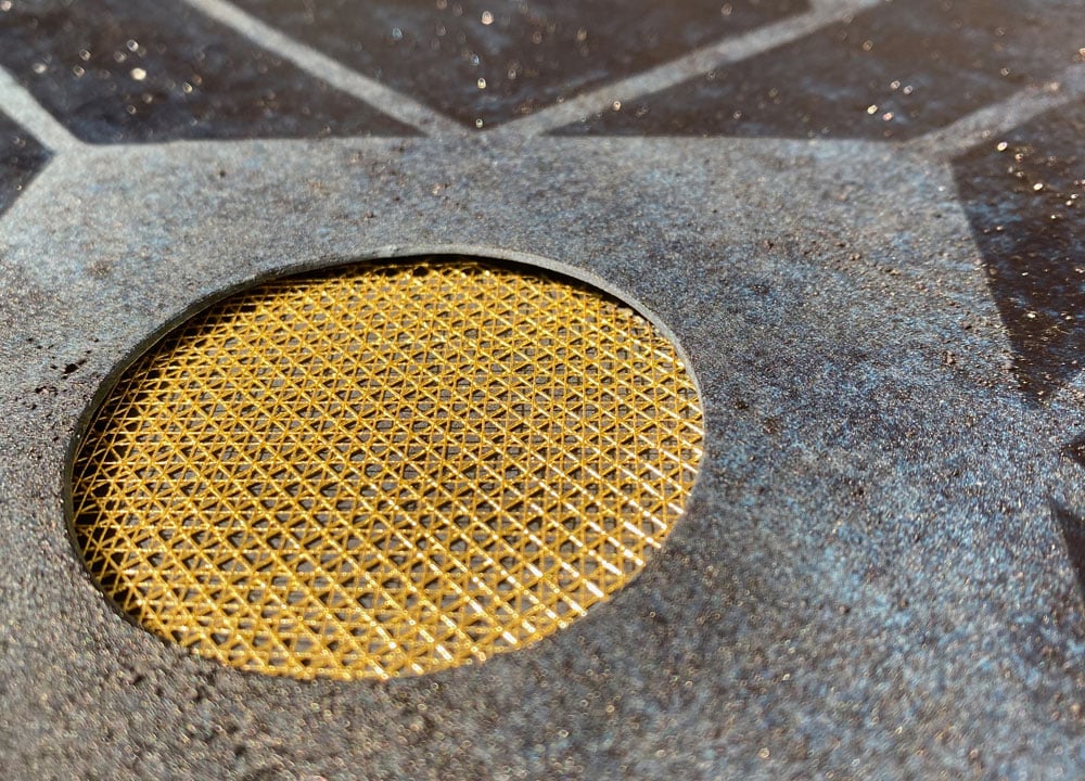 Close-up on an art piece featuring a knitted component