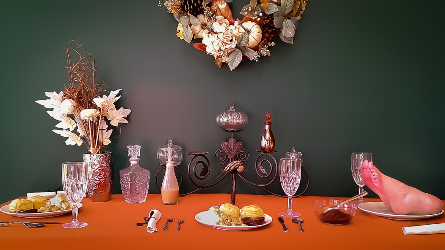feet served on a plate with a table decorated in traditional thanksgiving decorations