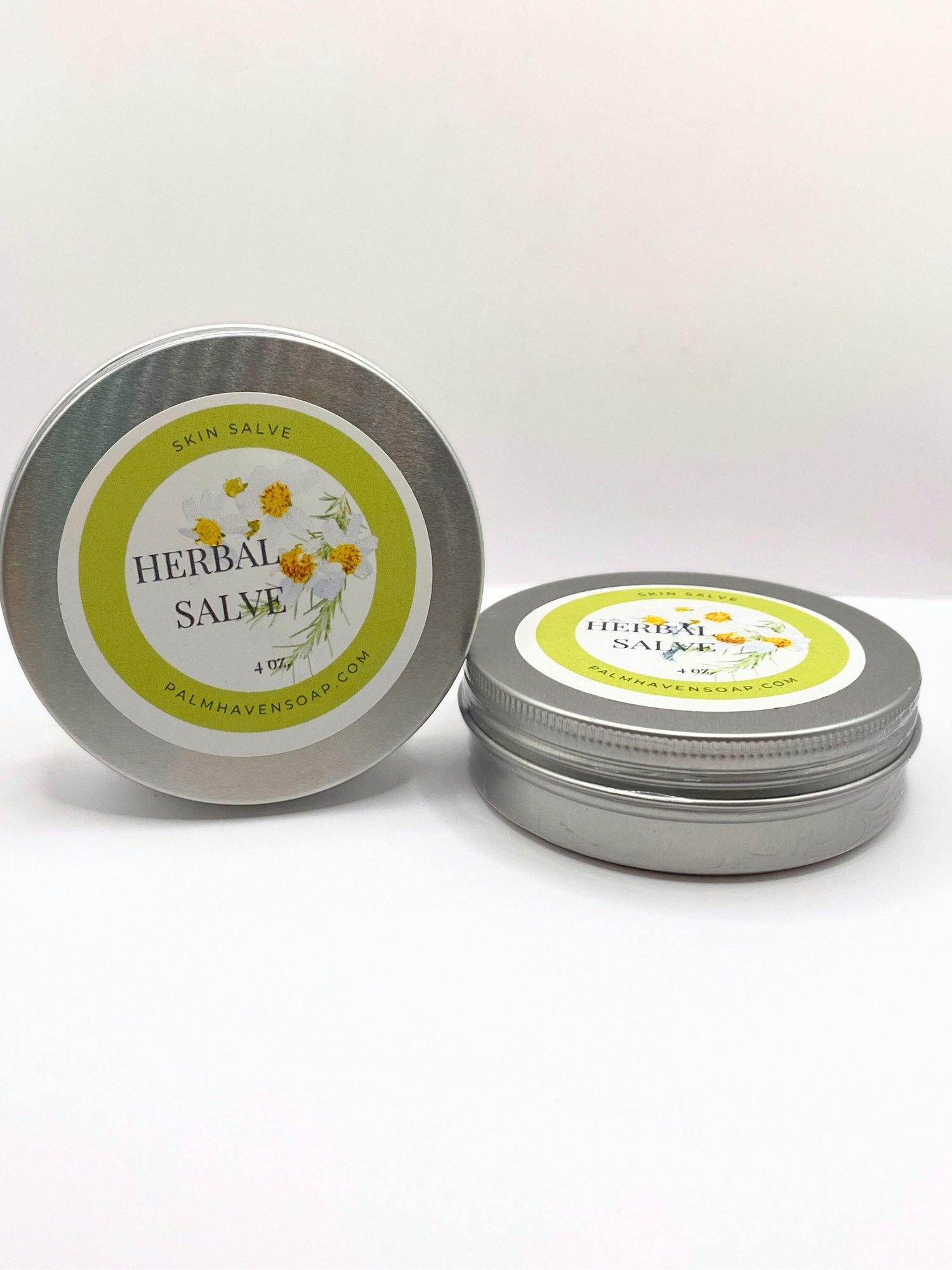 Handmade bidens alba skin salve in a round aluminum tin