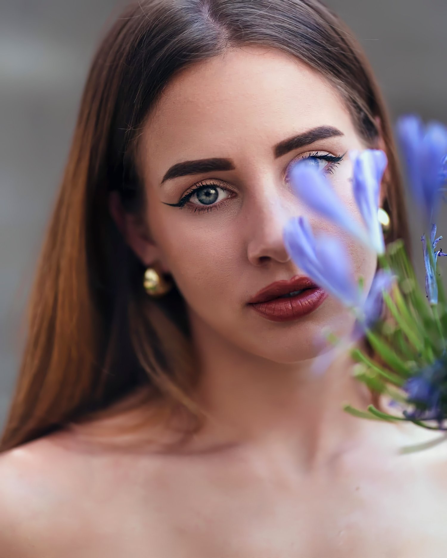 Close-up outdoor portrait with purple floral background, warm tones and relaxed expression – ADM Photography NJ — Outdoor Portrait by Anthony DelMauro
