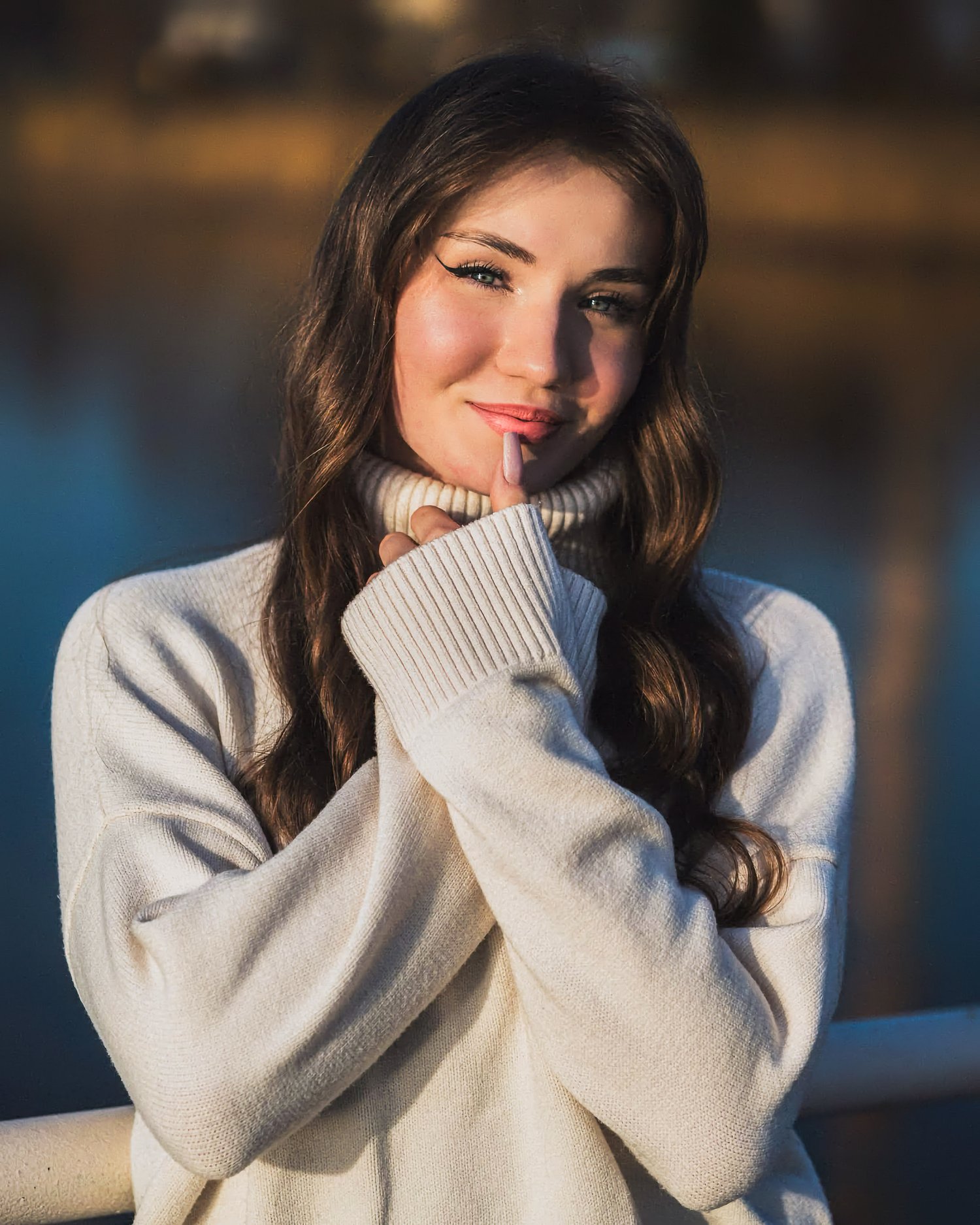 Outdoor portrait of woman in cozy sweater, soft natural light and warm tones – ADM Photography New Jersey — Portrait by ADM Photography