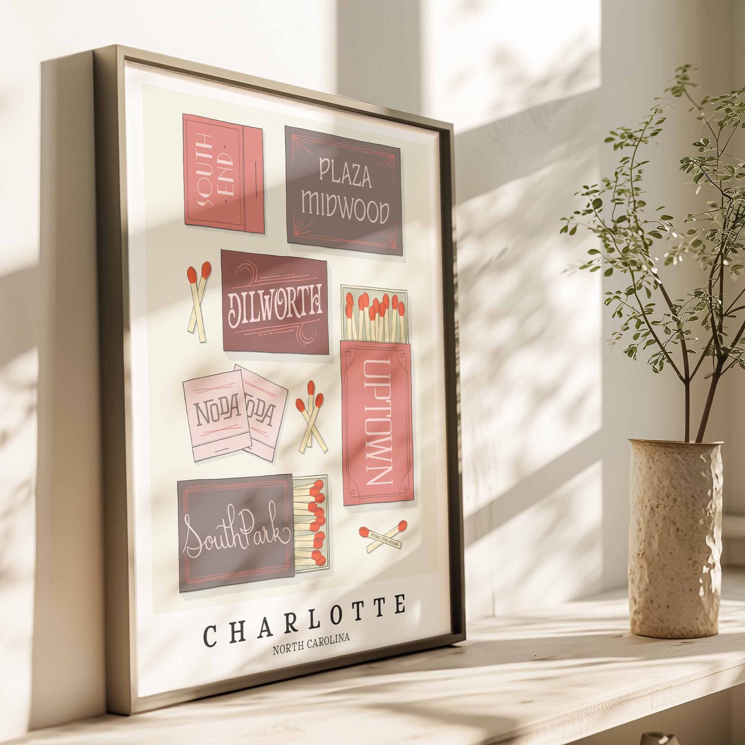 Hand-drawn Charlotte matchbox wall art featuring custom lettering in pink, burgundy, and gray tones
