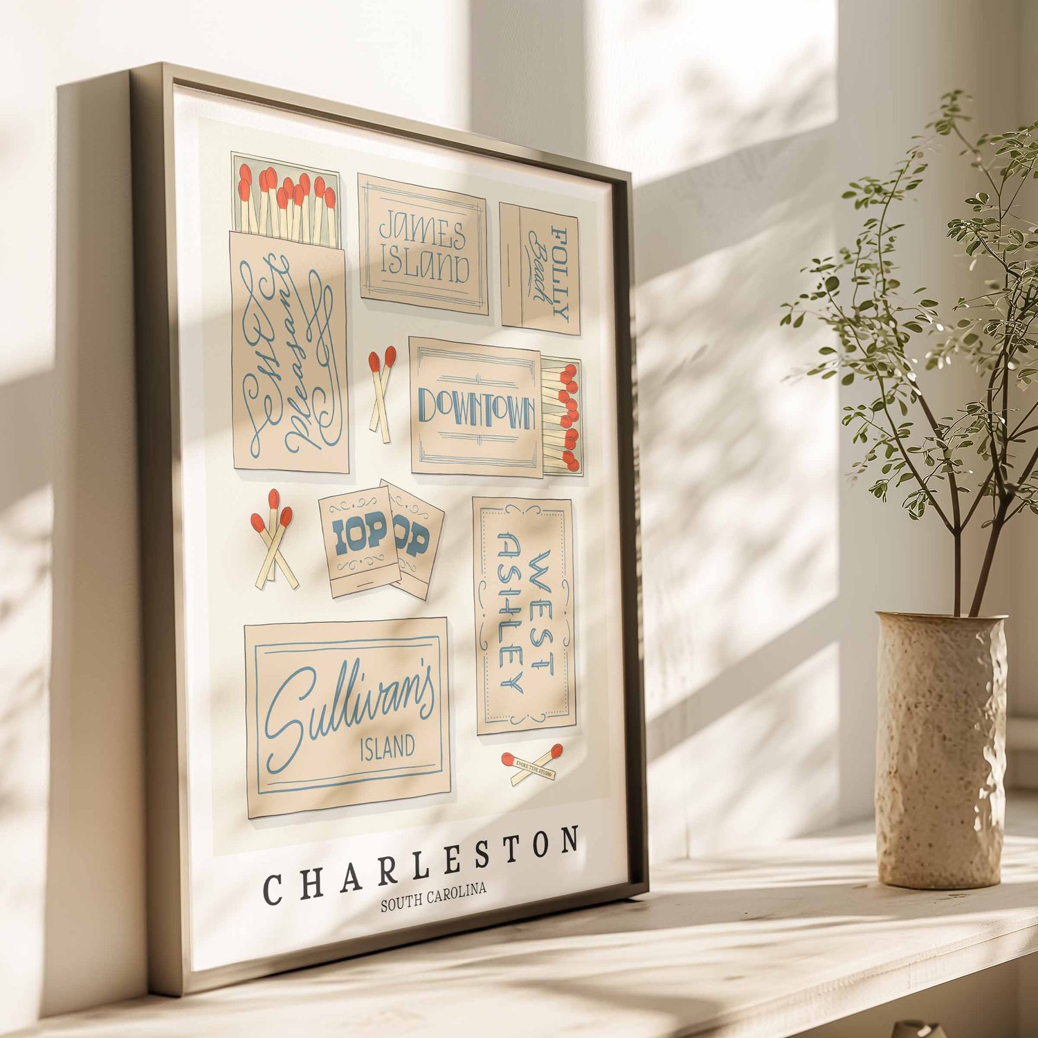 Typography-focused Charleston wall art with illustrated matchboxes in soft blue and beige hues