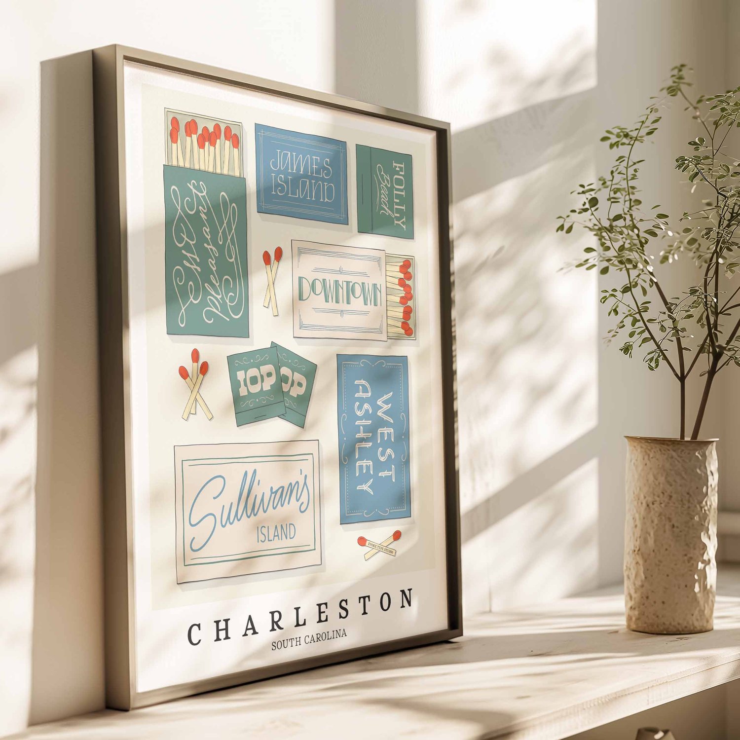 Hand-drawn Charleston matchbox wall art featuring coastal-inspired lettering in soft blue, green, and beige tones