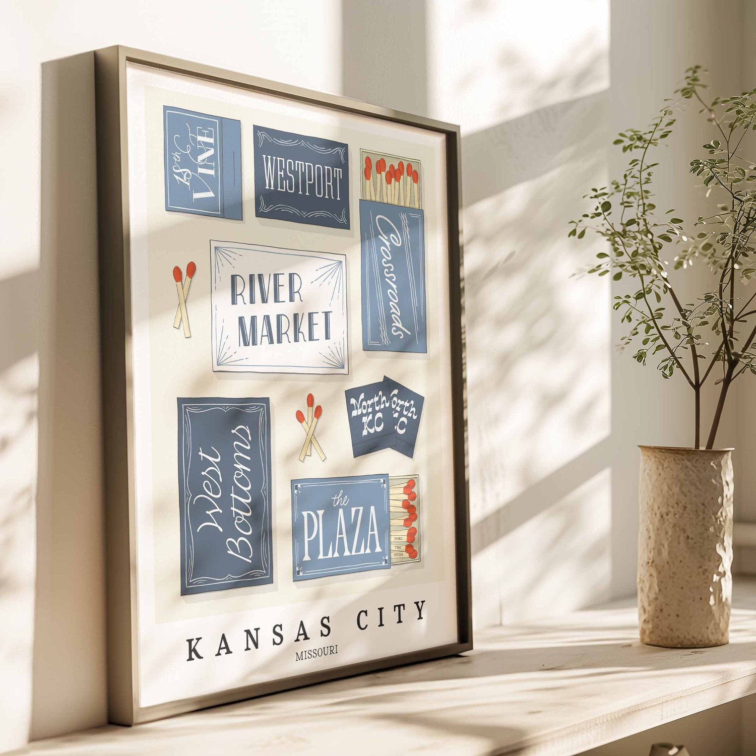 Hand-drawn Kansas City matchbox wall art featuring custom lettering in various shades of blue