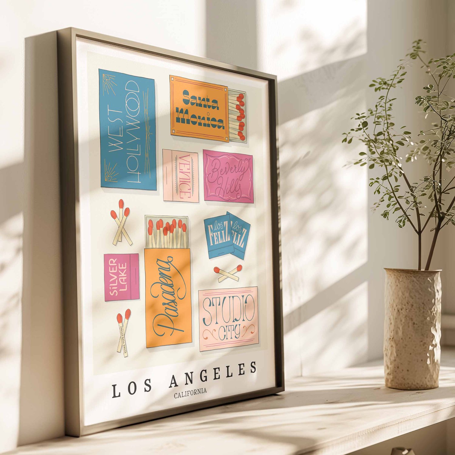 Hand-drawn Los Angeles matchbox wall art featuring custom lettering in bright blue, pink, and orange tones