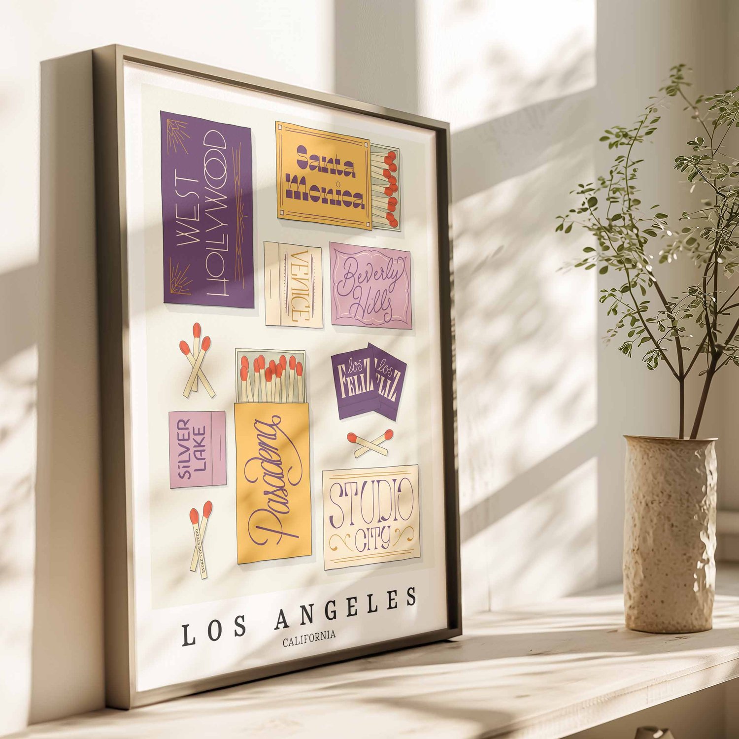 Hand-drawn Los Angeles matchbox wall art featuring custom lettering in purple and yellow tones
