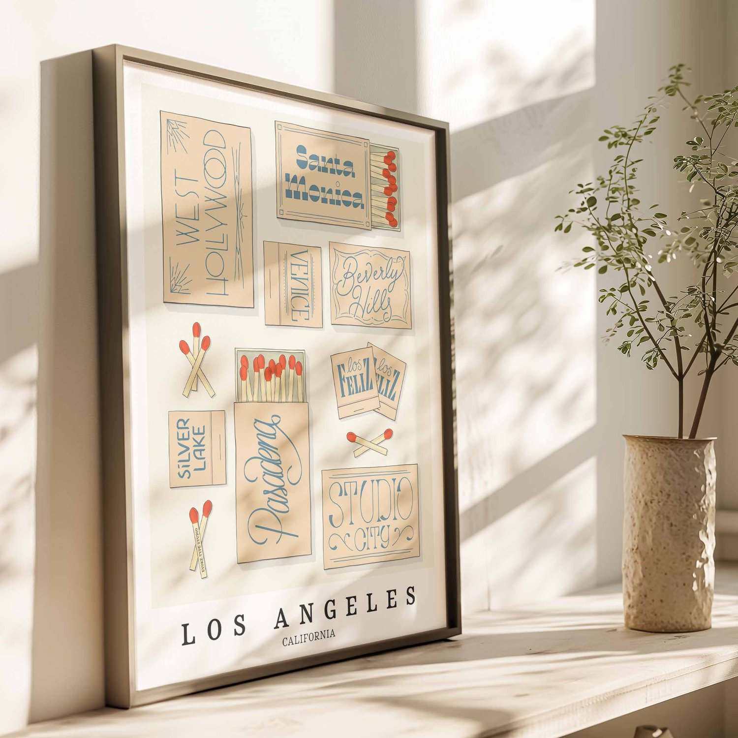 Hand-drawn Los Angeles matchbox wall art featuring custom lettering in soft beige and blue tones