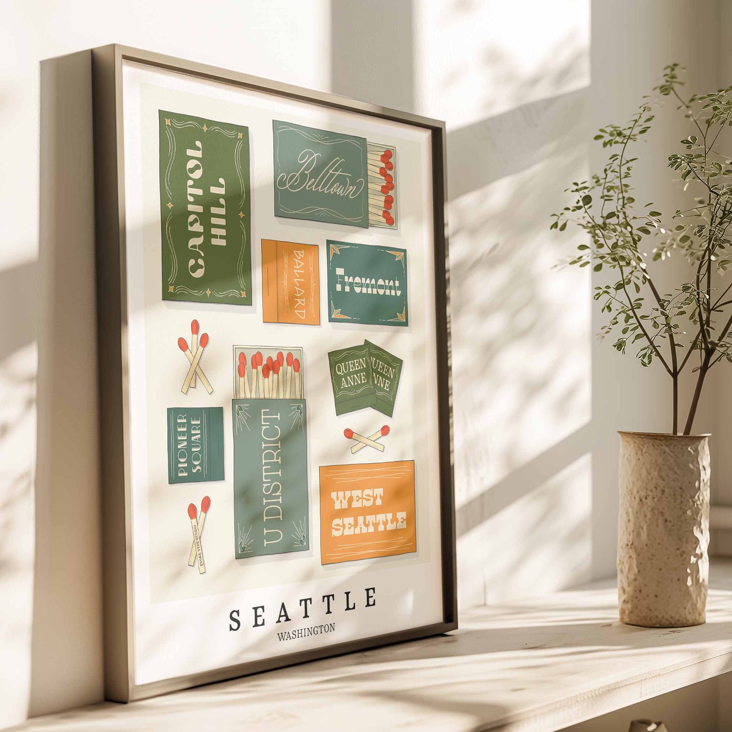 Hand-drawn Seattle matchbox wall art featuring custom lettering in green, blue, and yellow tones