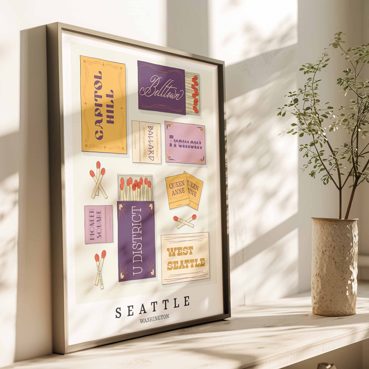 Hand-drawn Seattle matchbox wall art featuring custom lettering in purple and yellow tones